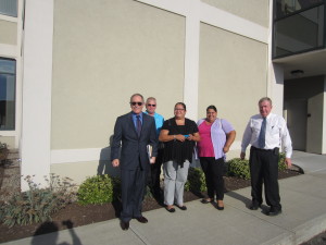 Left to right, SHA Executive Director William H. Abrashkin stands outside 60 Congress St. with BOC members Thomas Labonte, Angela Robles, Jessica Quinonez and Real Estate Developoment Project Administrator Sean F. Cahillane.