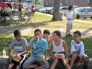 Children at SHA's Sullivan Apartments enjoy a meal at the annual T/R/S! back-to-school celebration.