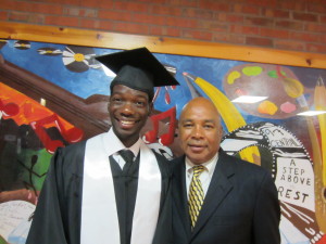 Central High School graduate Ahmed A. Moge with Springfield Housing Authority's Youth Engagement Officer.