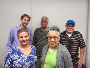 SHA ESL/Computer Instructor Nathan Bench, top left, with students in his adult computer literacy class at Riverview Apartments.