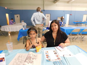 Leyla Castro, 6, and her mother, Elise Dones, at the Health Fair.