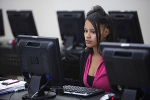 Woman working at the Neighborhood Network Center Computer Lab