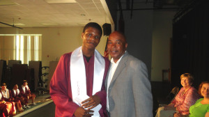 Kevin White, 18, received his scholarship from SHA Youth Engagement Coordinator Jimmie Mitchell.