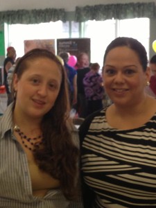 Program Clerk Hellen Exposito and Amy Santiago work the health fair.