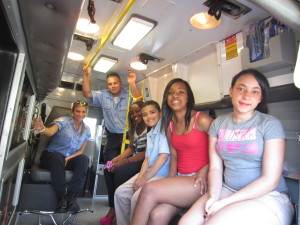 Checking out the ambulance, left to right: EMTs Kaliegh Ingeneri and Paul Novinsky, and Robinson Gardens youth Zaria Kelly, Christian Davis, Raemiah Brown and Jaleace Lindsay.