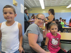 Cole Seery, 8, mom Melissa Seery, and Cianna Seery, 7, celebrate the last day of Hasbro Summer Learning Initiative at Dorman Elementary School.