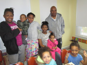 Latisa Gasque and her children, with SHA Youth Engagement Coordinator Jimmie Mitchell.