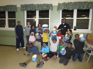 Children at Riverview Apartments and ADC staff show their Thanksgiving turkeys.