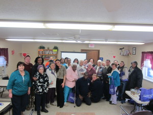 Jennie Lane Apartments residents gather in their community room following the fire safety session.