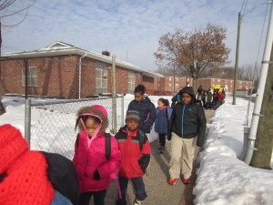 The walking school bus leaves Springfield Housing Authority's Sullivan Apartments and heads up to Boland Elementary School.
