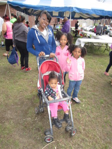 Sullivan Apartments resident Lachisa Smith with daughteres Nyasia, 9, Nevaeh, 6, and Anaia, almost 2, at the Spring Fling.