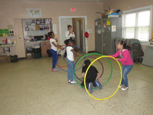 At Sullivan Apartments, Staci Andrews leads a session featuring colorful hoops.