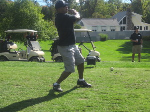 ADC Prevention Services President Arnold Cox takes a swing.