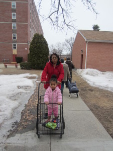 Aurelia Verato and her granddaughter Angelie Marti are ready to pick up groceries outside Riverview Apartments.