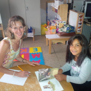 Camp literacy consultant Joanne Lanzillo-Epaul with camper Jasmarie Collazo, who is 8.