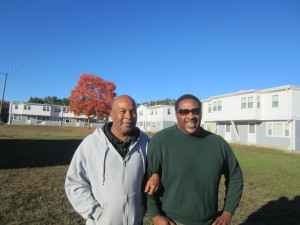 Springfield Housing Authority Youth Engagement Coordinator Jimmie Mitchell and businessman Alvin Woods outside at Robinson Gardens Apartments. The men are old friends.