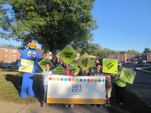 Children and friends at Springfield Housing Authority's Sullivan Apartments celebrate National Walk to School Day as they prepare to walk to Boland Elementary School.