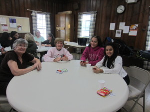 Left to right, Forest Park Manor residents Jane Sienkiewicz and Lorraine Shaw, and Forest Park Middle School eighth graders Catelyn Vazquez and Cynthia Rosa.