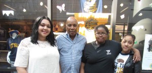 Putnam High School seniors Khialeny Peña, 17, Briana Lee, 19 and Fergie Perez, 18, with SHA Youth Engagement Coordinator Jimmie Mitchell. The three each won a $1,000 scholarship in memory of Mitchell's father, the late Farris Mitchell, to help them pay for college in the fall.