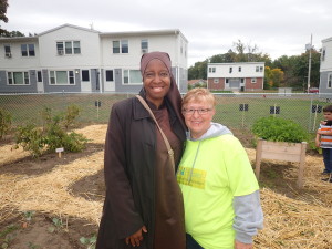 Anna Muhammad of the Food Policy Council and Lynne Cimino of Talk/Read/Succeed!, in the community garden at Robinson Gardens Apartments.