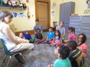 Children in the summer learning program at Sullivan Apartments make a visit to the Springfield City Library.