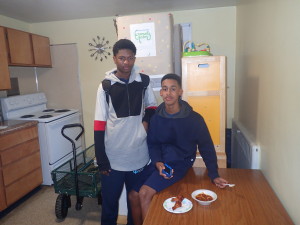 Kashawn Lenorr, 15, and Nate Hunt, 16, enjoying the afternoon snack at Robinson Gardens.