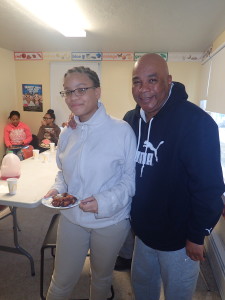 Thirteen-year-old Shamya Cotto-Gates and SHA Youth Coordinator Jimmie Mitchell share a smile.