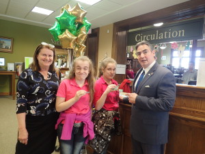 City Library Director Molly Fogarty and Mayor Domenic Sarno join the T/R/S! kick-off event, joining twins Charisma and Julianna Campbell at the Indian Orchard branch library.