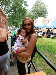 Yaneth Rivera holds her new baby Elijah, at Duggan Park Apartments.