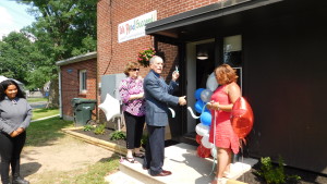Springfield Housing Authority Executive Director William Abrashkin cuts the ribbon, celebrating the new T/R/S! center at Duggan Park Apartments.